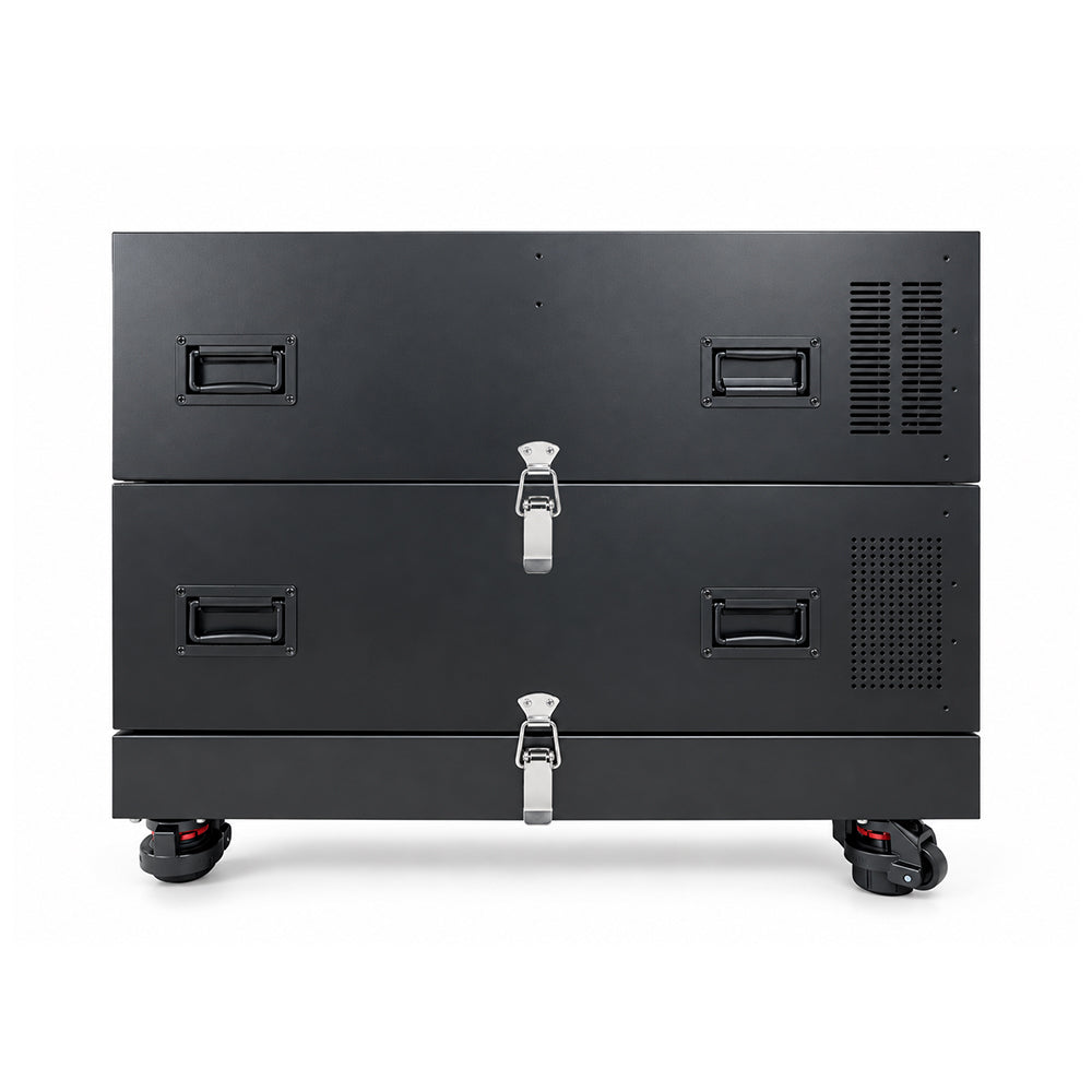 A black dual-bay battery storage system with three stacked compartments, featuring silver latch locks on the front, side handles, ventilation grilles, and caster wheels, shown against a plain white background.